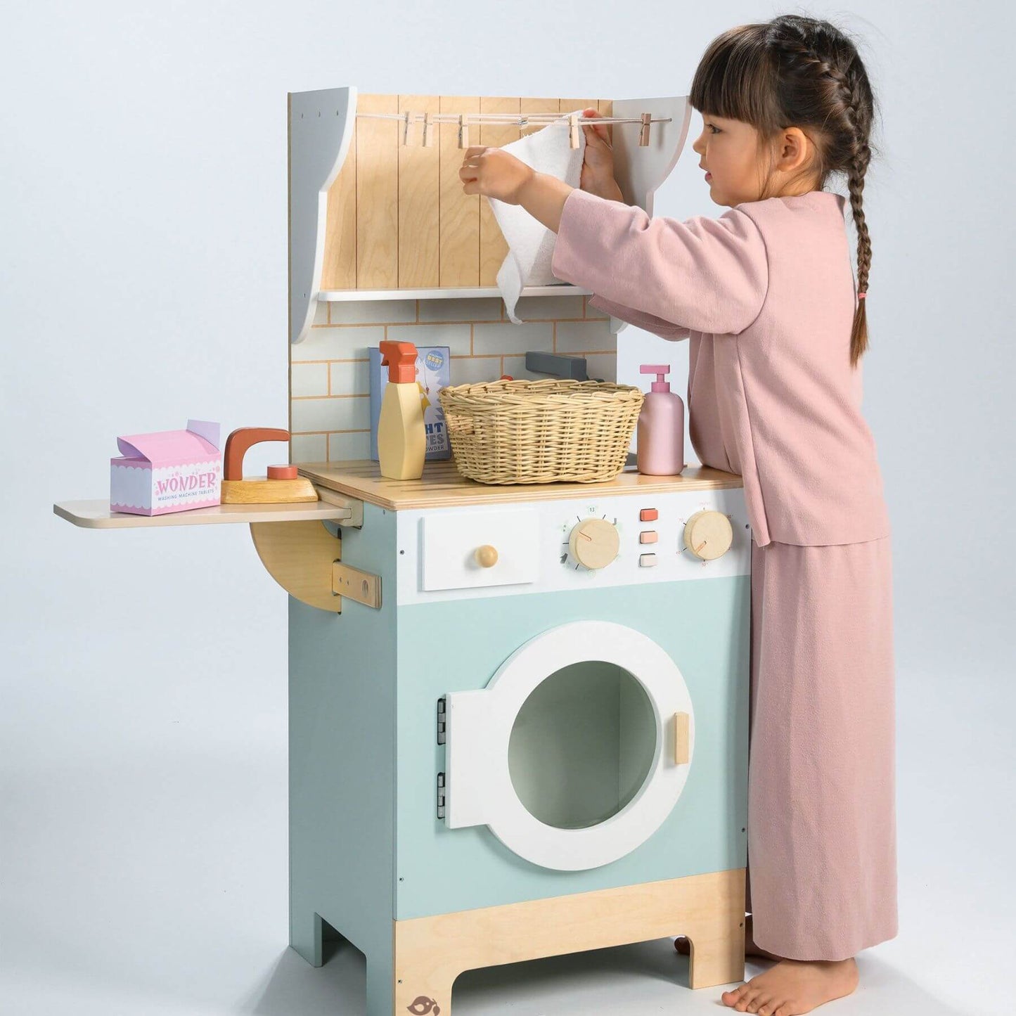 Child playing with Tender Leaf Laundrette