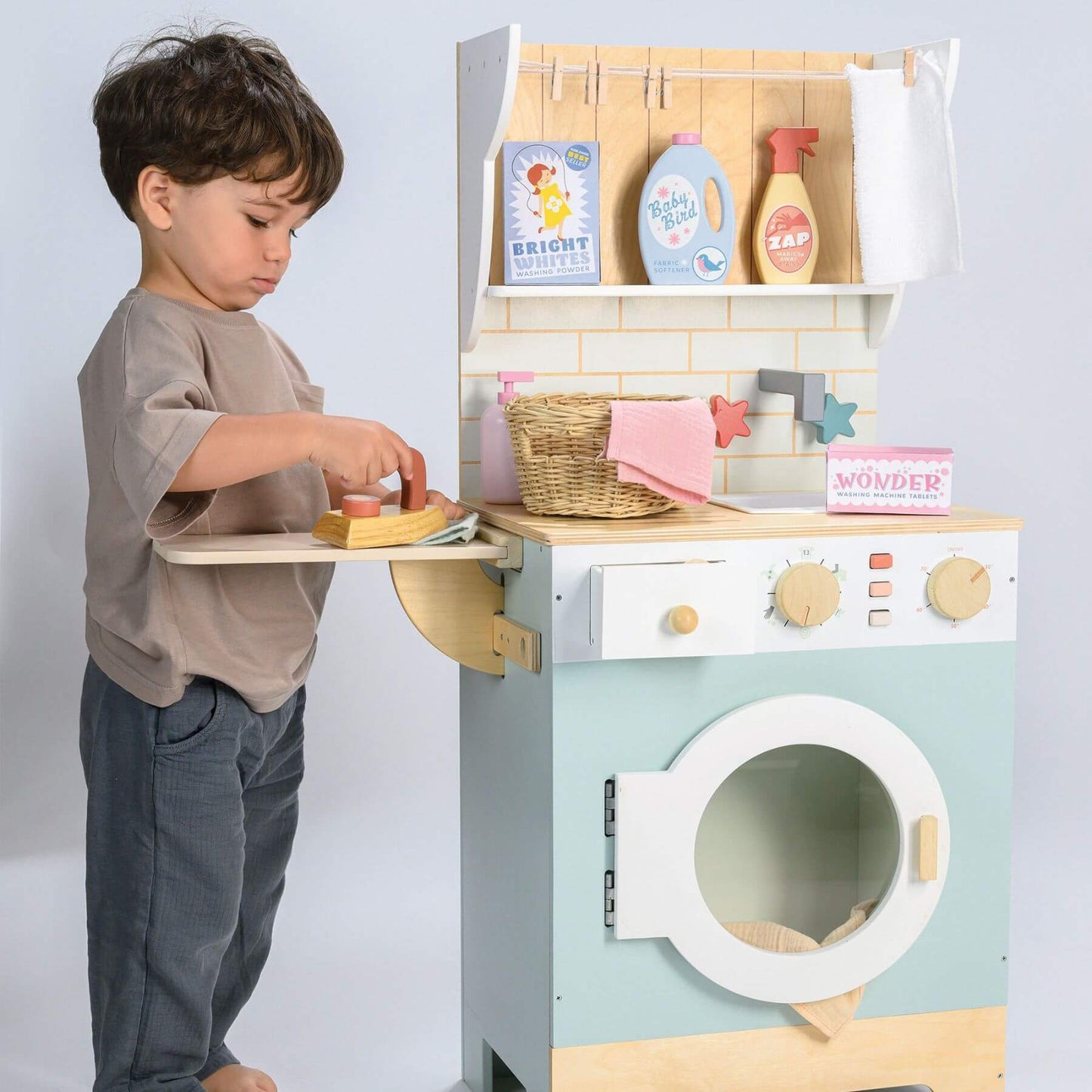Child playing with Tender Leaf Laundrette