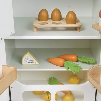 Wooden toy set with eggs, carrots, and cheese on a white shelf