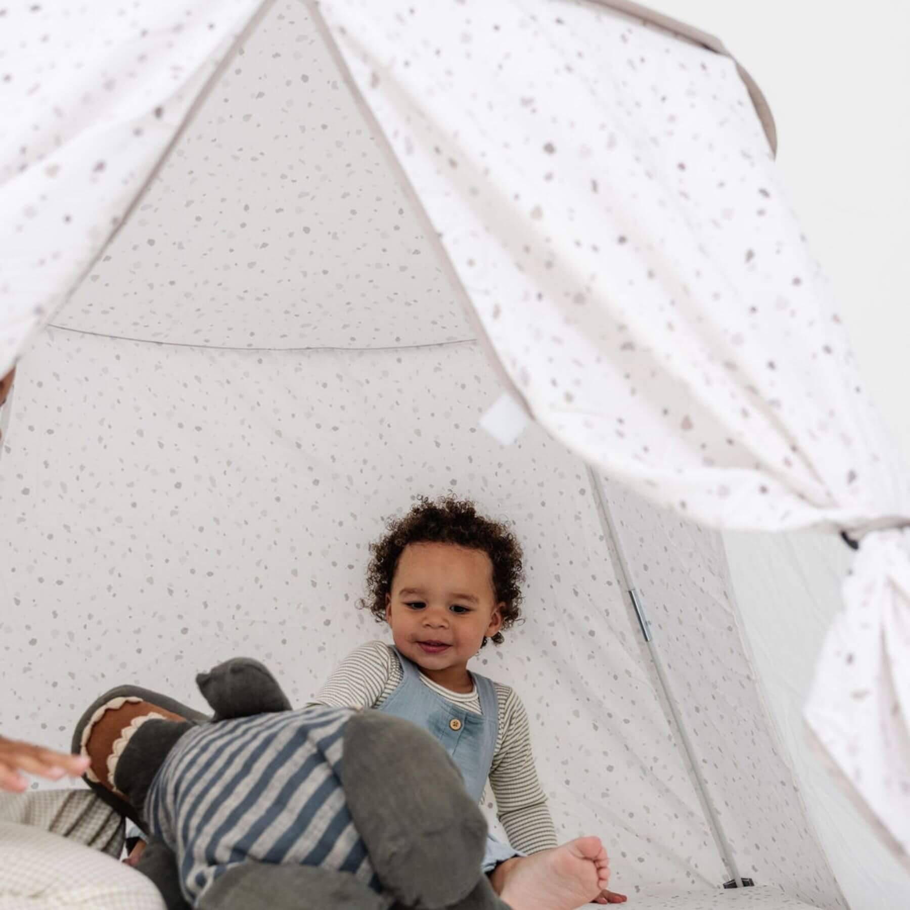 Kid playing inside Toki Kids Terrazzo Chalk Play Tent