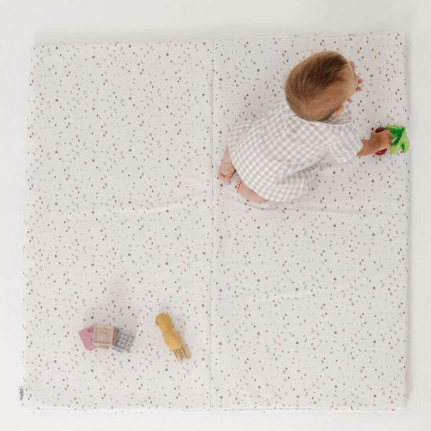 Baby Playing on Toki Kids Terrazzo Chalk Vegan Leather Mat