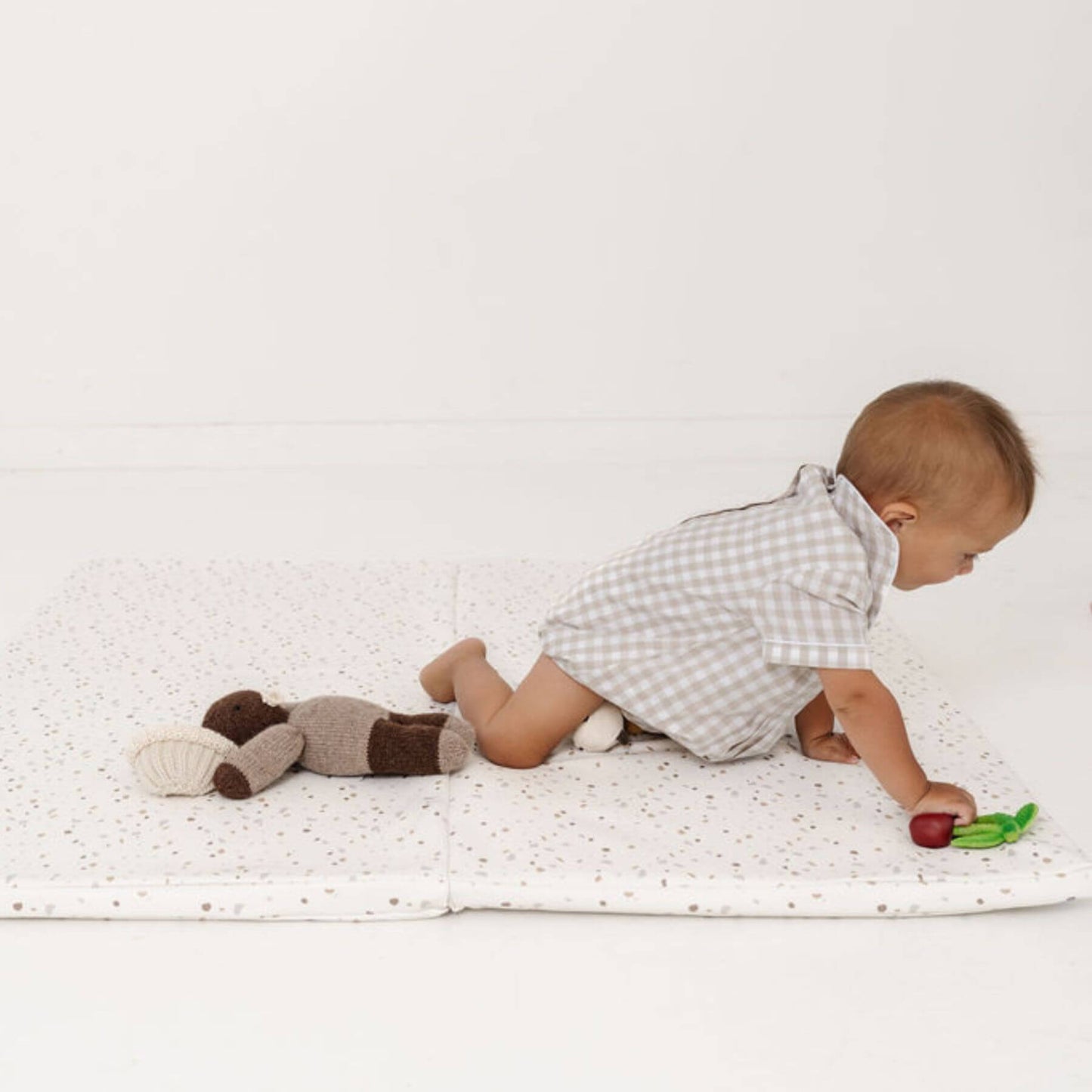 Baby Playing on Toki Kids Terrazzo Chalk Vegan Leather Mat