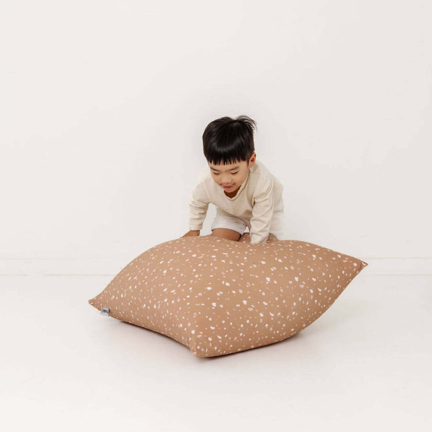 Child playing with Toki Kids Terrazzo Clay Bean Bag