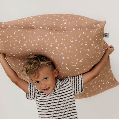 Child holding Toki Kids Terrazzo Clay Bean Bag