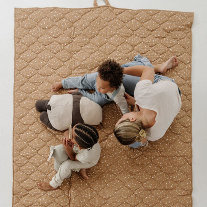 Three children sitting on Toki Kids Terrazzo Clay Picnic Blanket