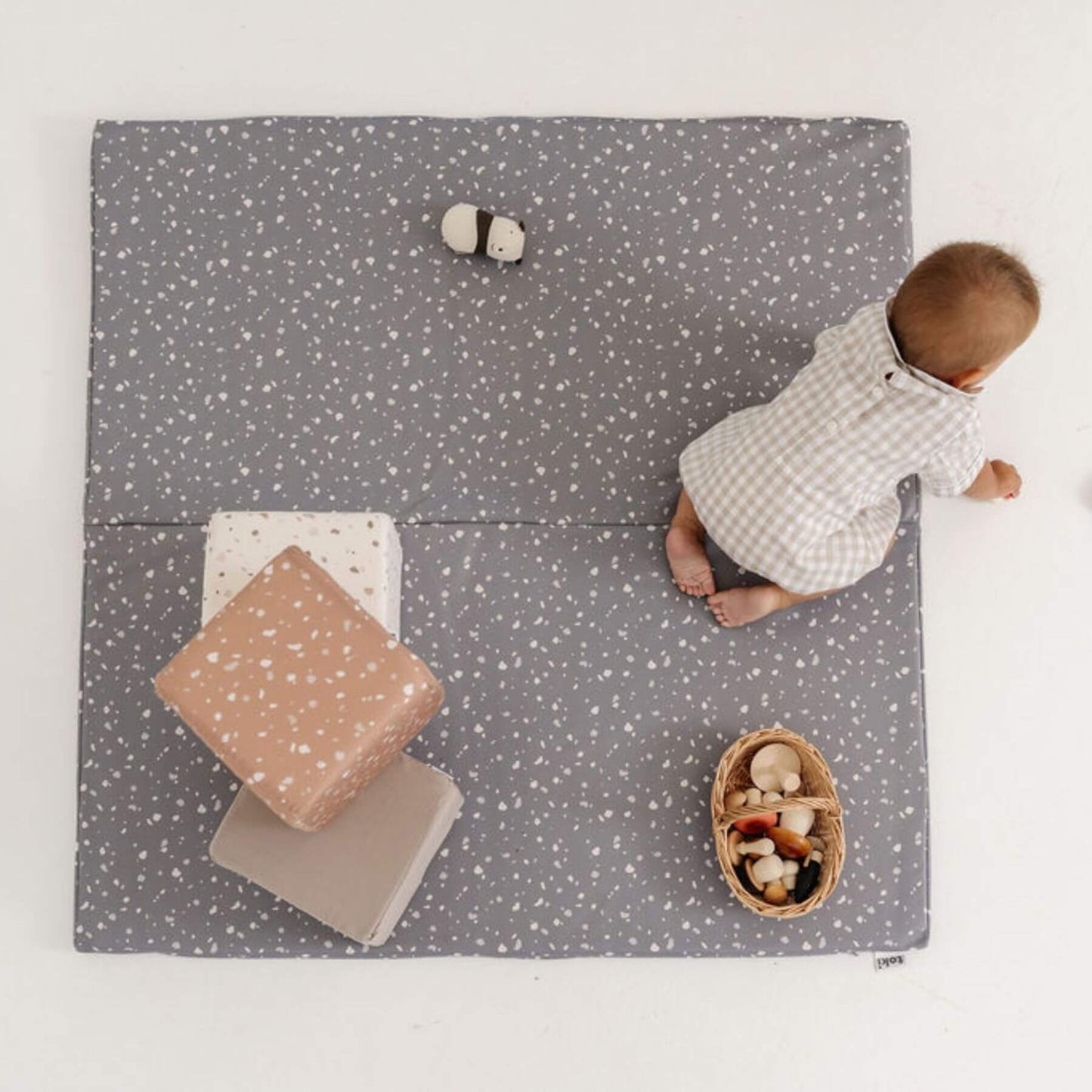 Baby playing on playmat with Toki Kids Play Cubes