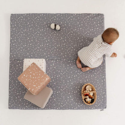 Baby playing on playmat with Toki Kids Play Cubes