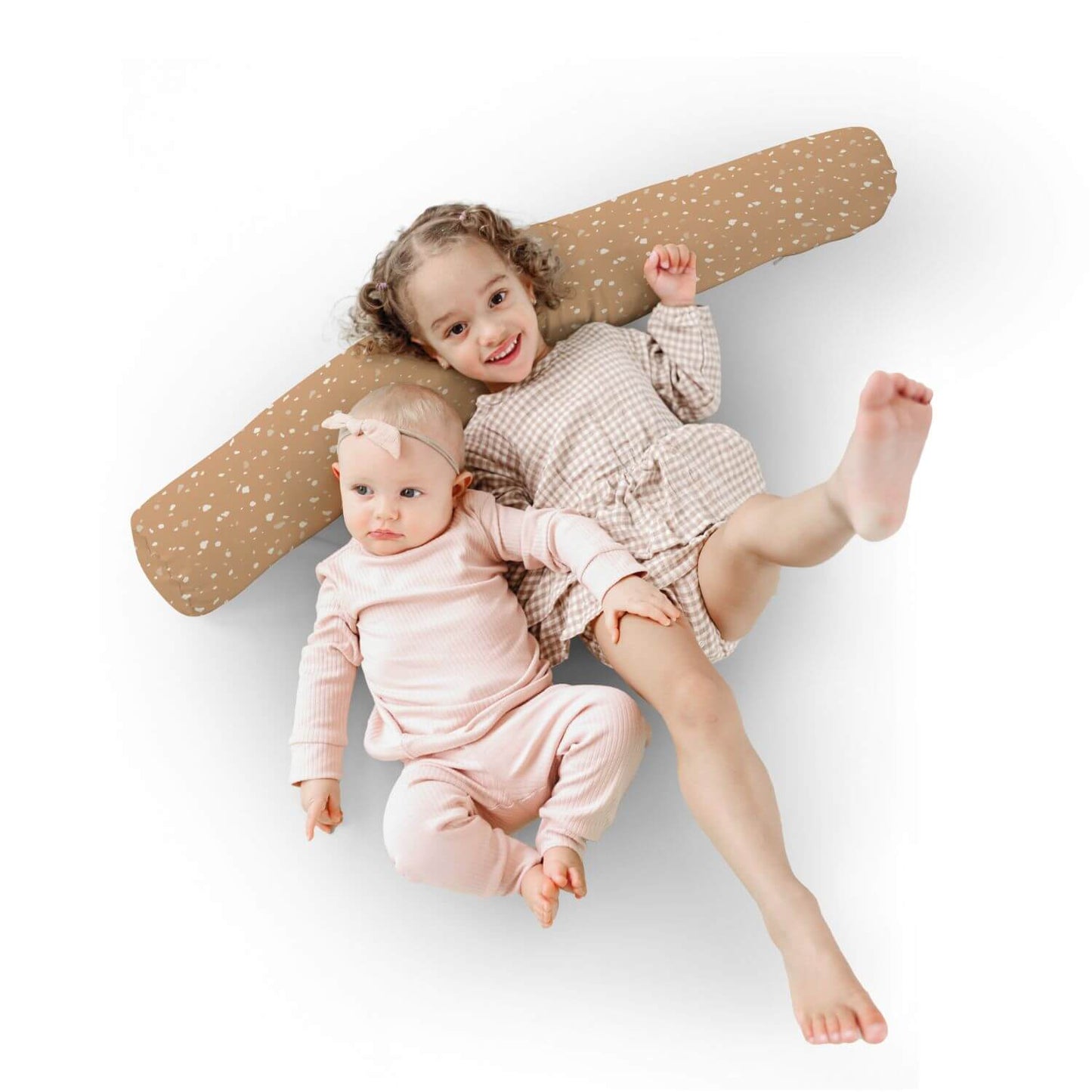 Two children in matching outfits lying on Toki Kids Terrazzo Clay Support Pillow