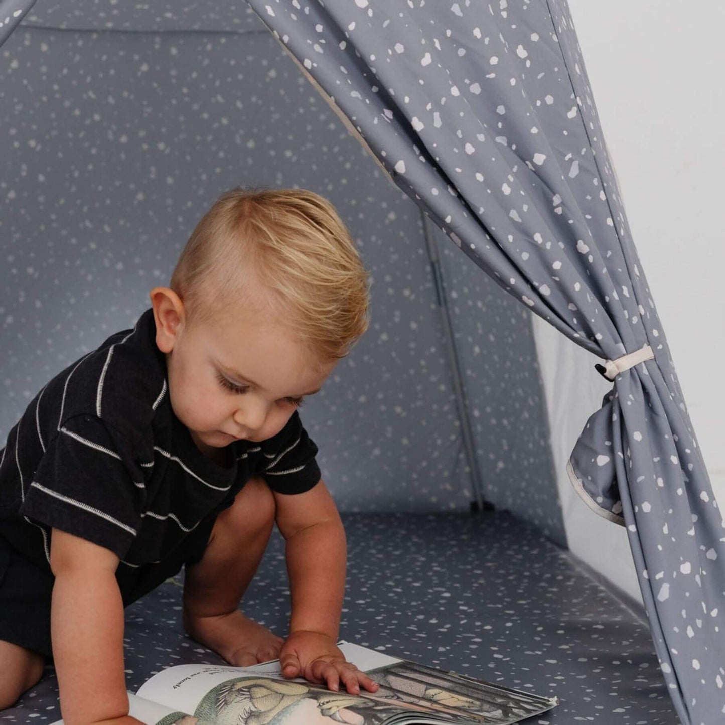 Kid playing inside Toki Kids Terrazzo Slate Play Tent
