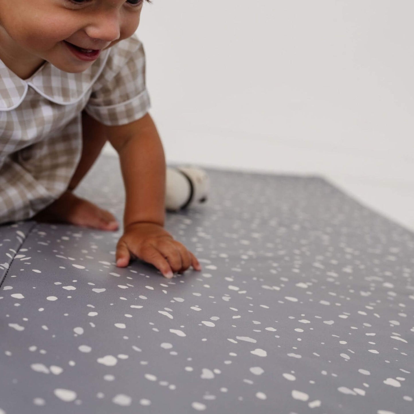 Boy Playing on Toki Kids Terrazzo Slate Vegan Leather Mat