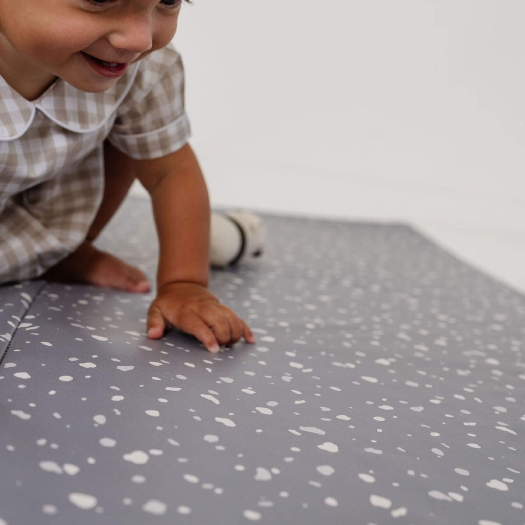 Boy Playing on Toki Kids Terrazzo Slate Vegan Leather Mat