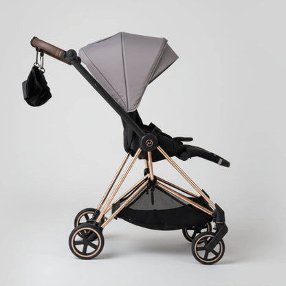 Modern baby stroller with The Stroller Sling - All Weather on a white background