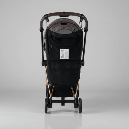 Black stroller with The Stroller Sling - All Weather on a gray background