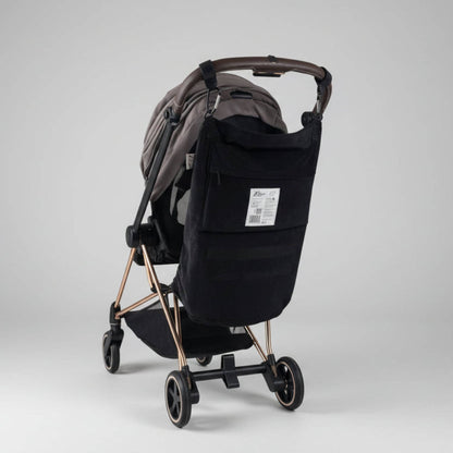Black stroller with The Stroller Sling - All Weather on a light gray background