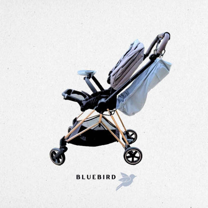 Baby stroller with folded seat on a light gray background, featuring the 'Bluebird' color.