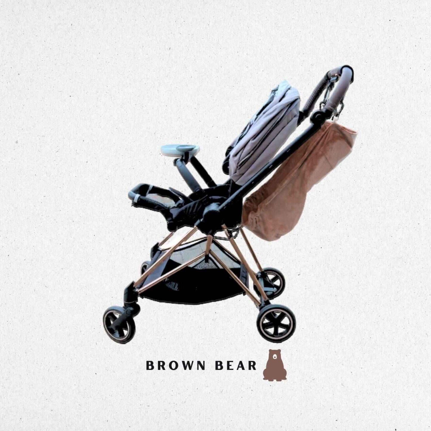 Foldable stroller with The Stroller Sling on a light gray background, featuring 'Brown Bear' branding.