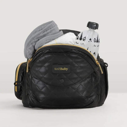 The Tushbaby Hip Carrier - Black/Gold with baby items