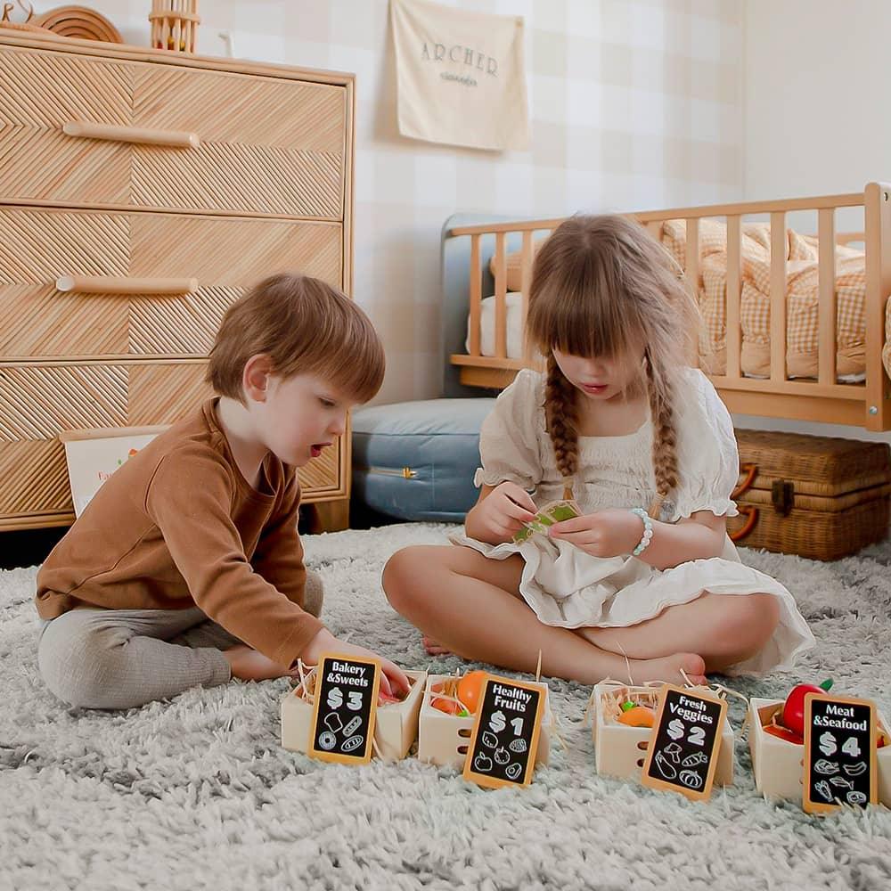 Kids Playing Tiny Land® Wooden Play Food in bedroom