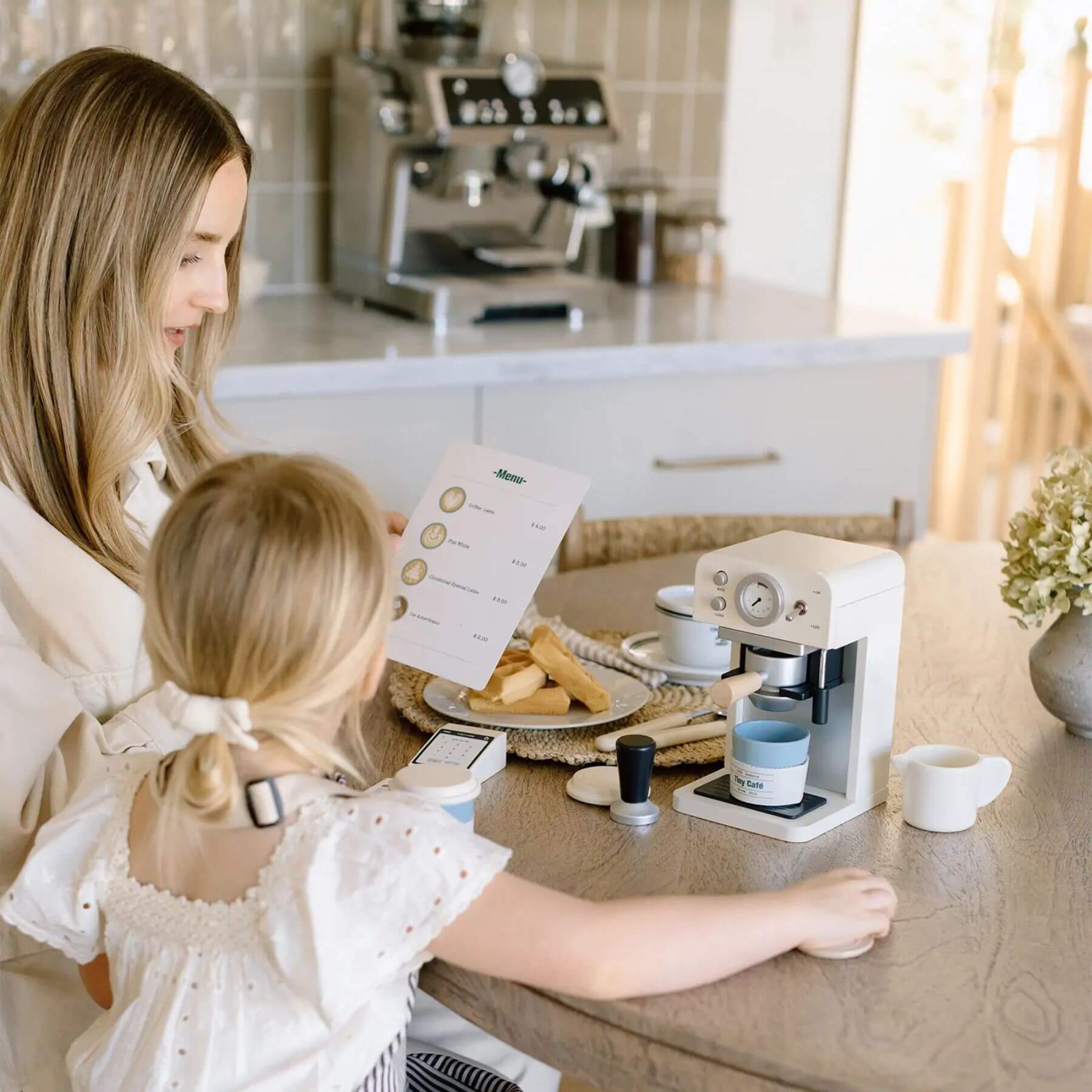 Woman and child in a kitchen with Tiny Land® Children’s Coffee Maker