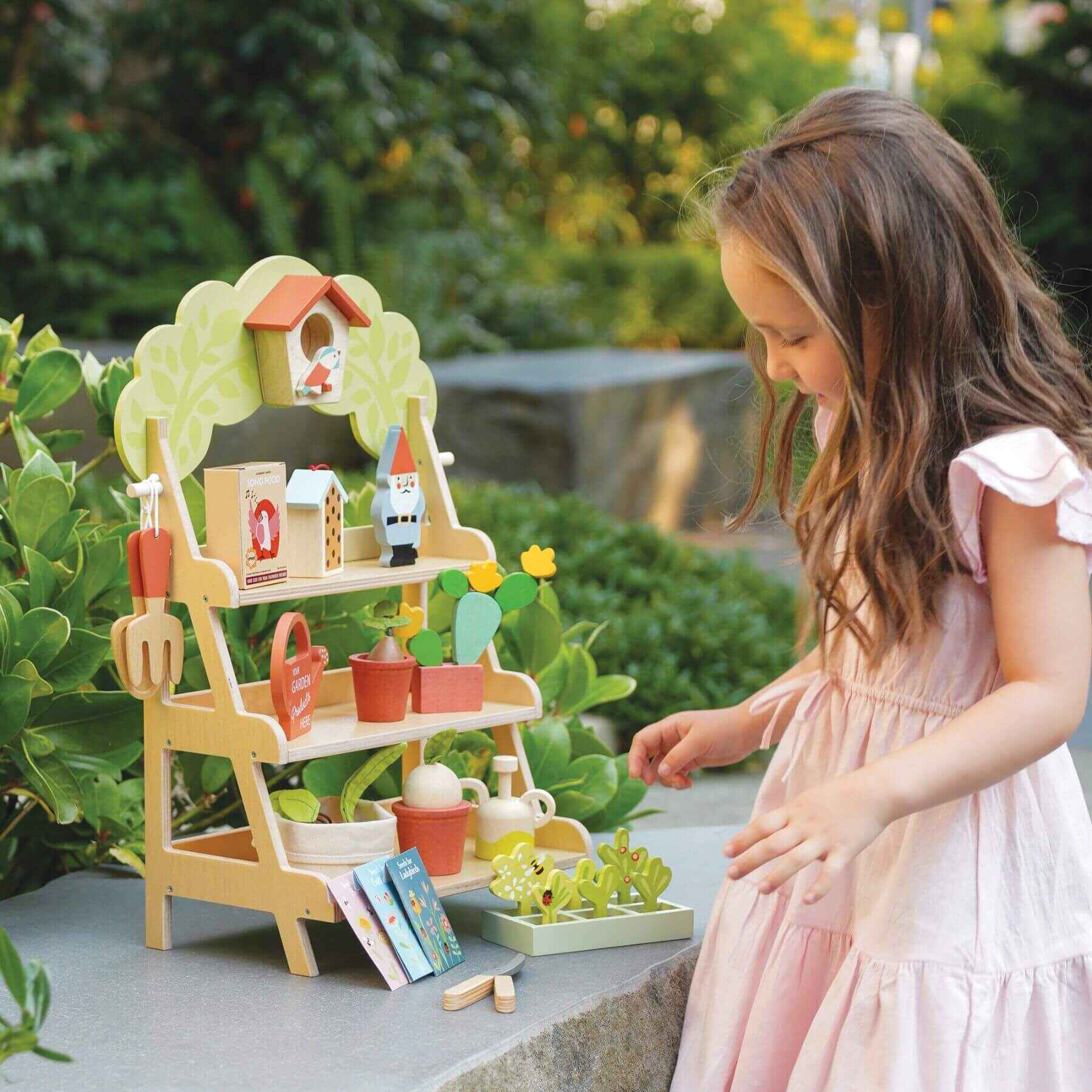 Child playing with Tender Leaf Garden Centre outdoors
