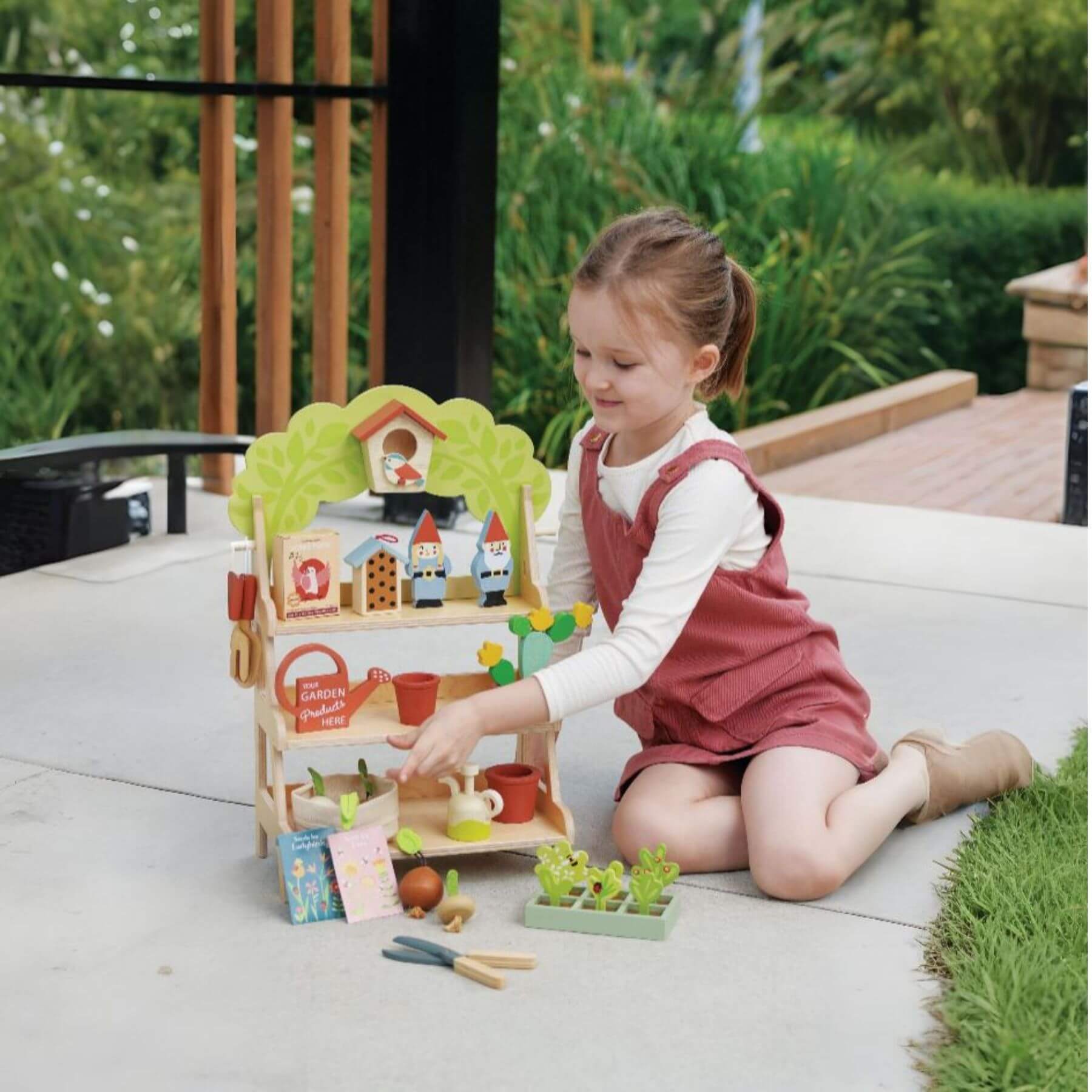Child playing with Tender Leaf Garden Centre outdoors