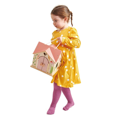 Child in a yellow dress holding Tender Leaf Rosewood Cottage