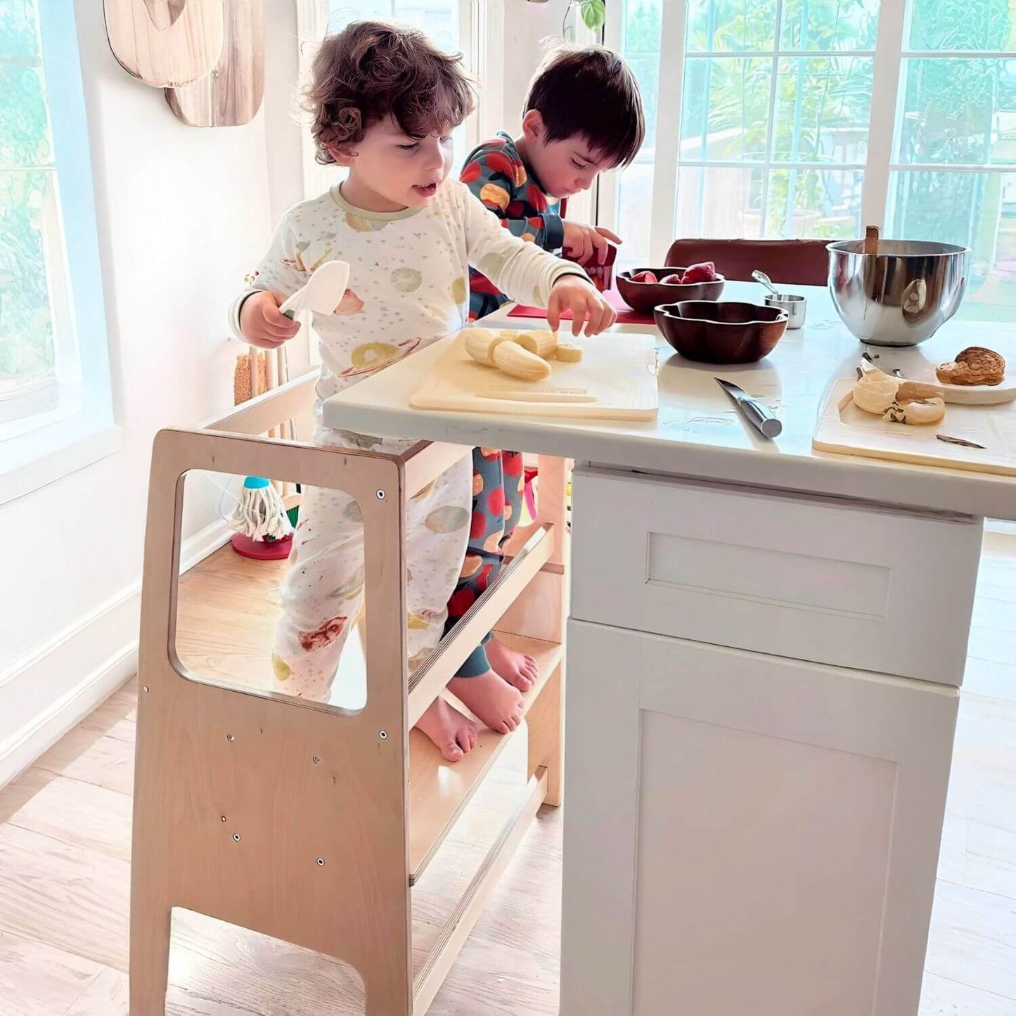 Kids Standing on RAD Children's Furniture Toddler Tower, Cutting Fruits