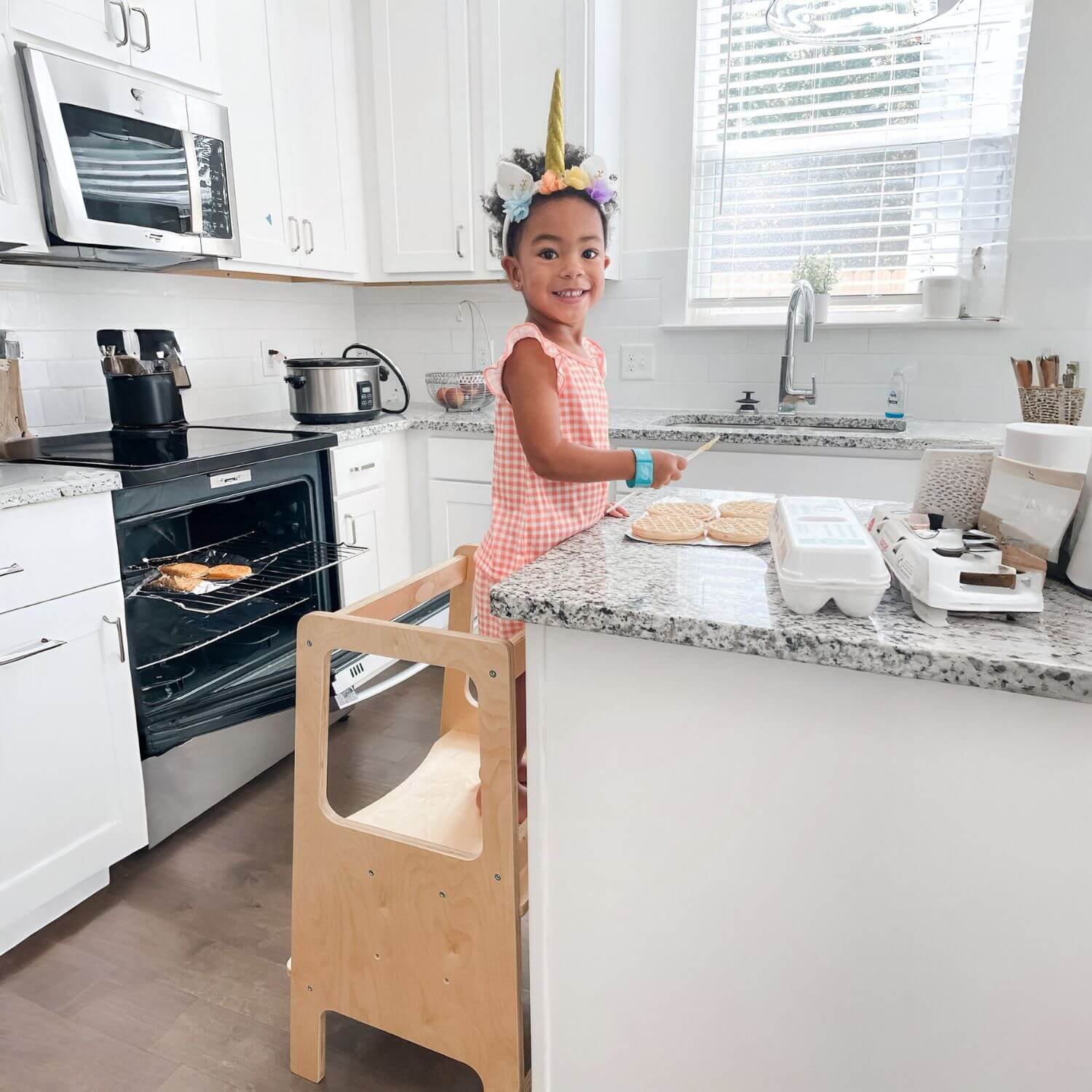 Girl Standing on RAD Children's Furniture Toddler Tower, Cooking Cookies