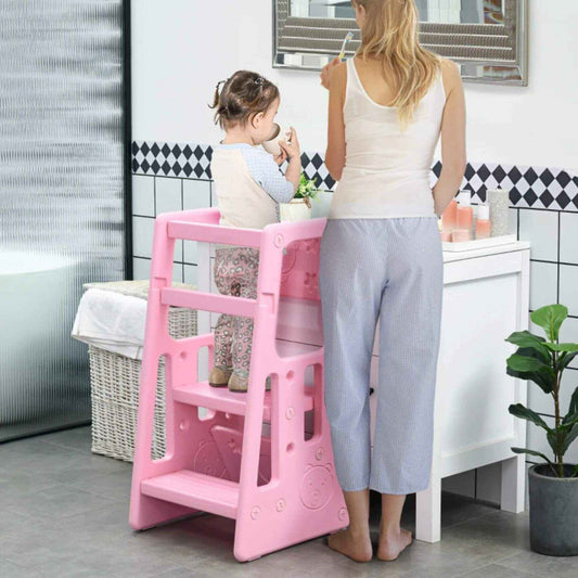 Girl Using Qaba Toddler Tower with Adjustable Height Pink