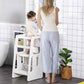 Girl Using Qaba Toddler Tower with Adjustable Height White