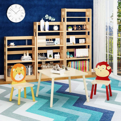 Children's playroom with wooden shelves, MOONRIVER 3-Pieces Toddler Activity Table and Chair Set - Lion & Monkey on a blue and green patterned rug.
