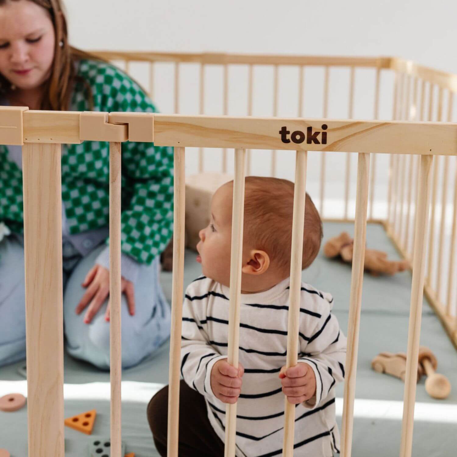 Woman and baby playing in Toki Kids Playpen - Mega Size in Wood