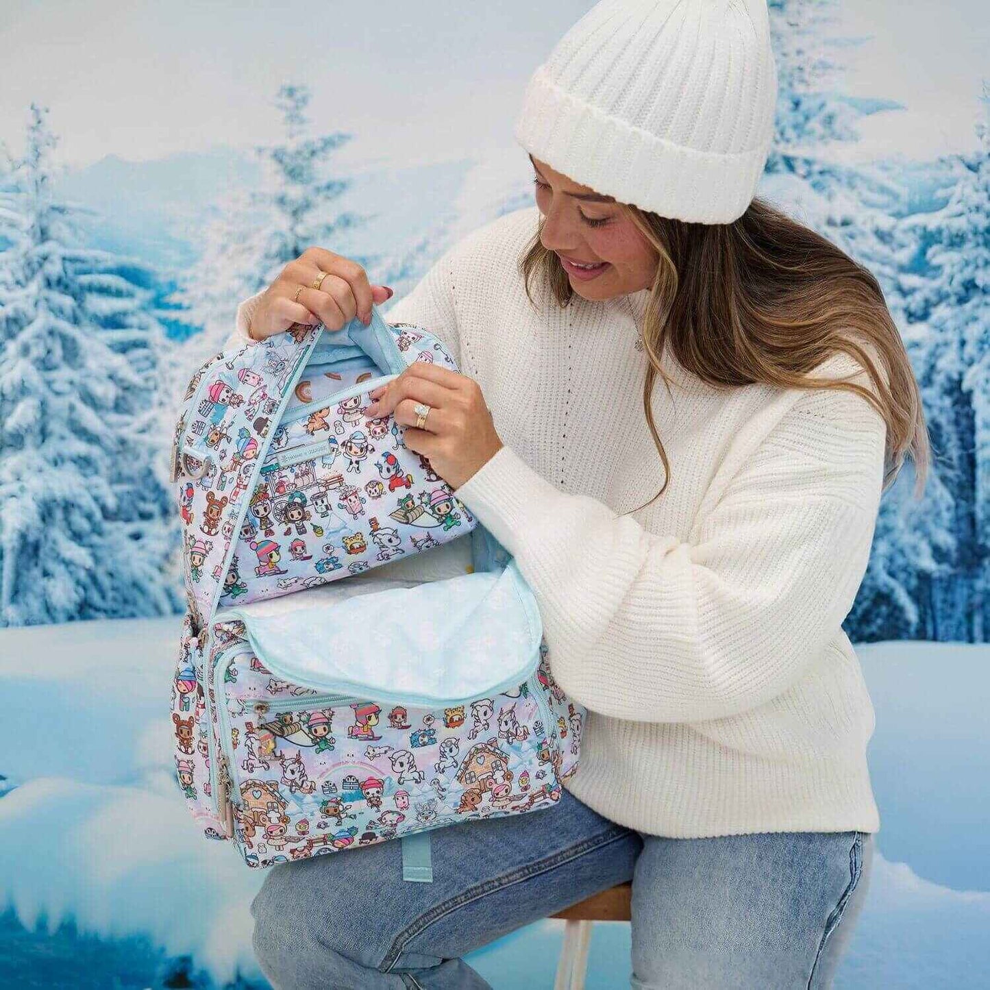 Woman Holding tokidoki Snow Day Zealous Backpack Diaper Bag — Ice Blue