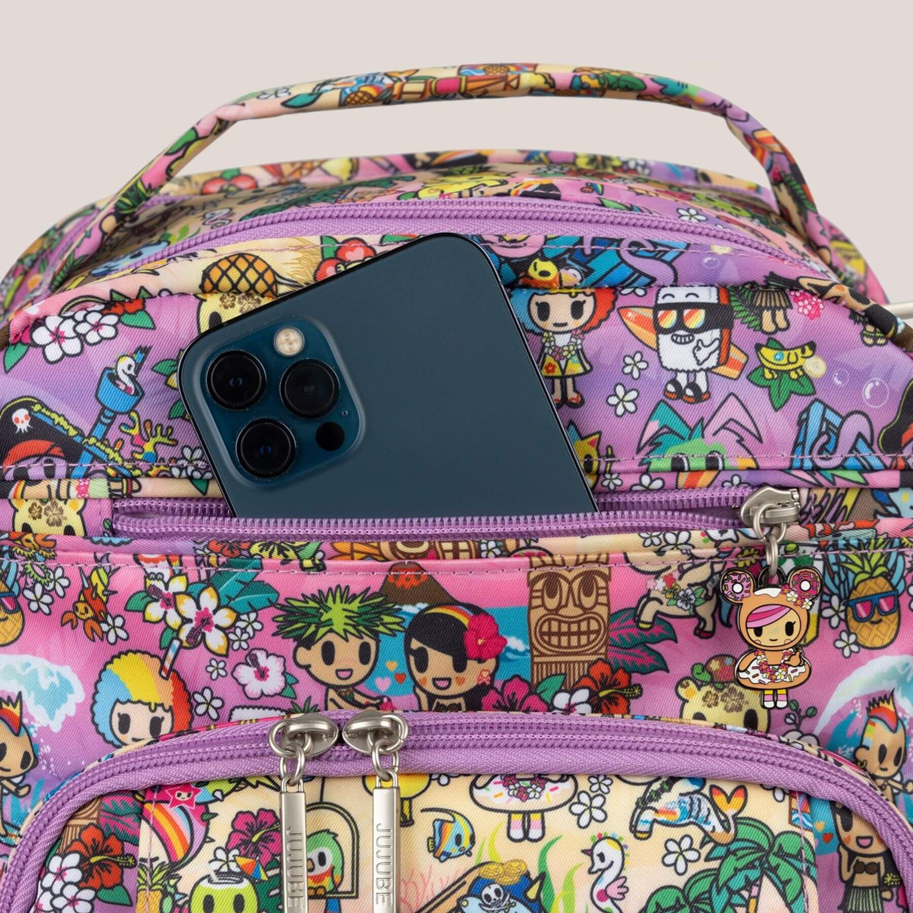 tokidoki Be Right Back Diaper Backpack and a phone on top