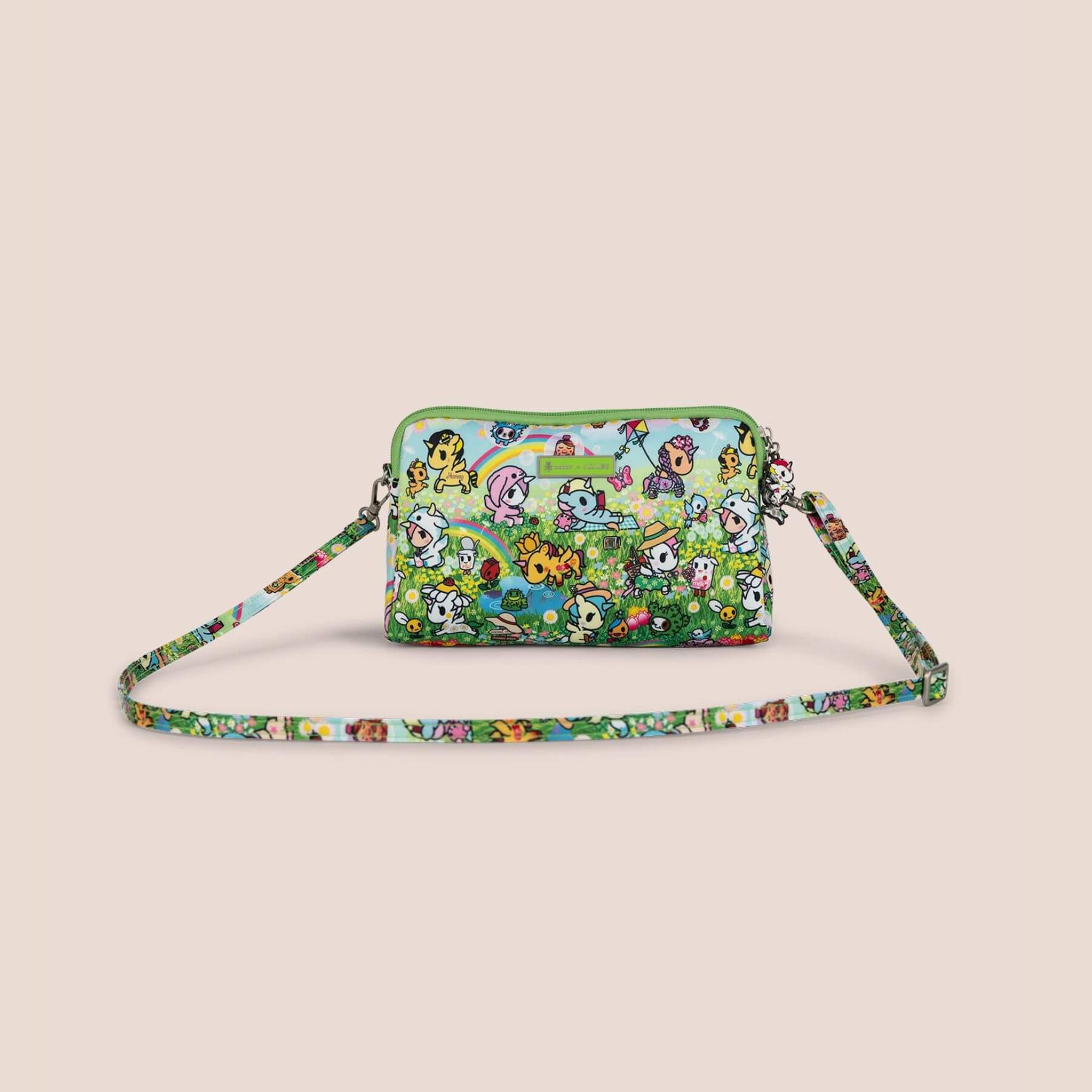 Colorful crossbody bag with character design on a beige background