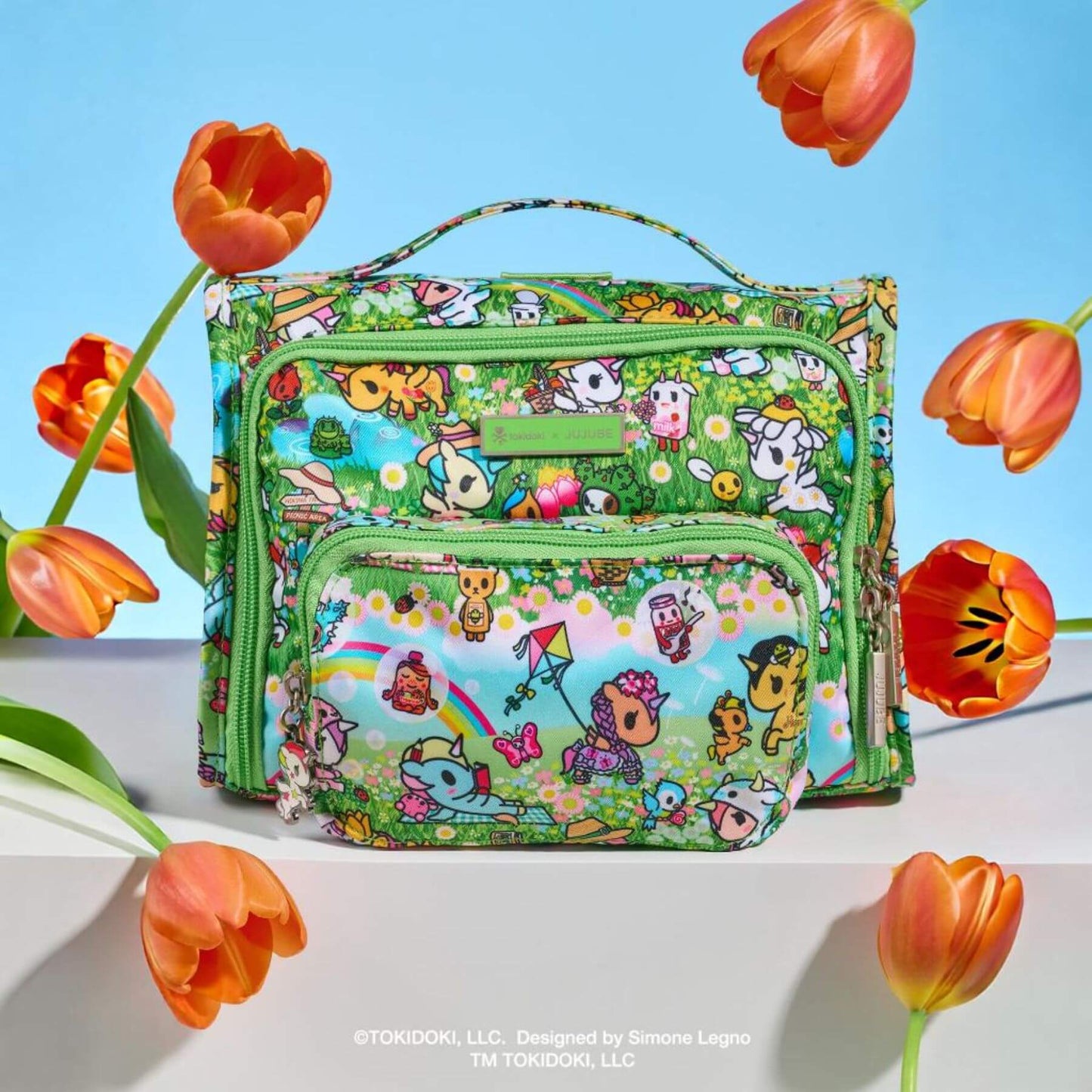 tokidoki The Bestie Small Messenger Handbag - Meadow Blooms on a blue background