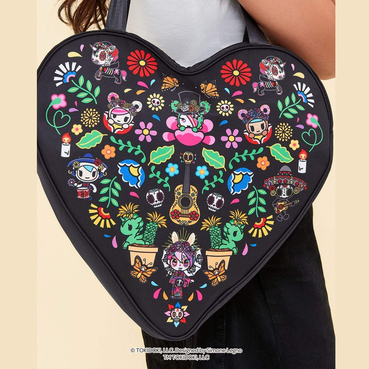 tokidoki Heart Tote Diaper Bag – Dia de los Muertos, shown being worn by a person.