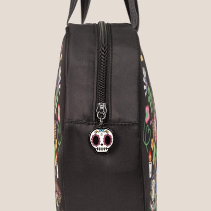 A close-up of tokidoki Heart Tote Diaper Bag – Dia de los Muertos