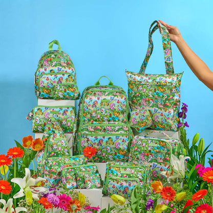 Collection of floral-patterned bags and a hand holding a bag against a blue background with flowers.