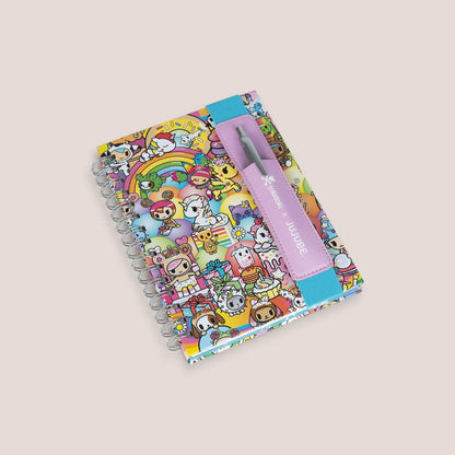 tokidoki Spiral Oliver Notebook and a pen on a light beige background