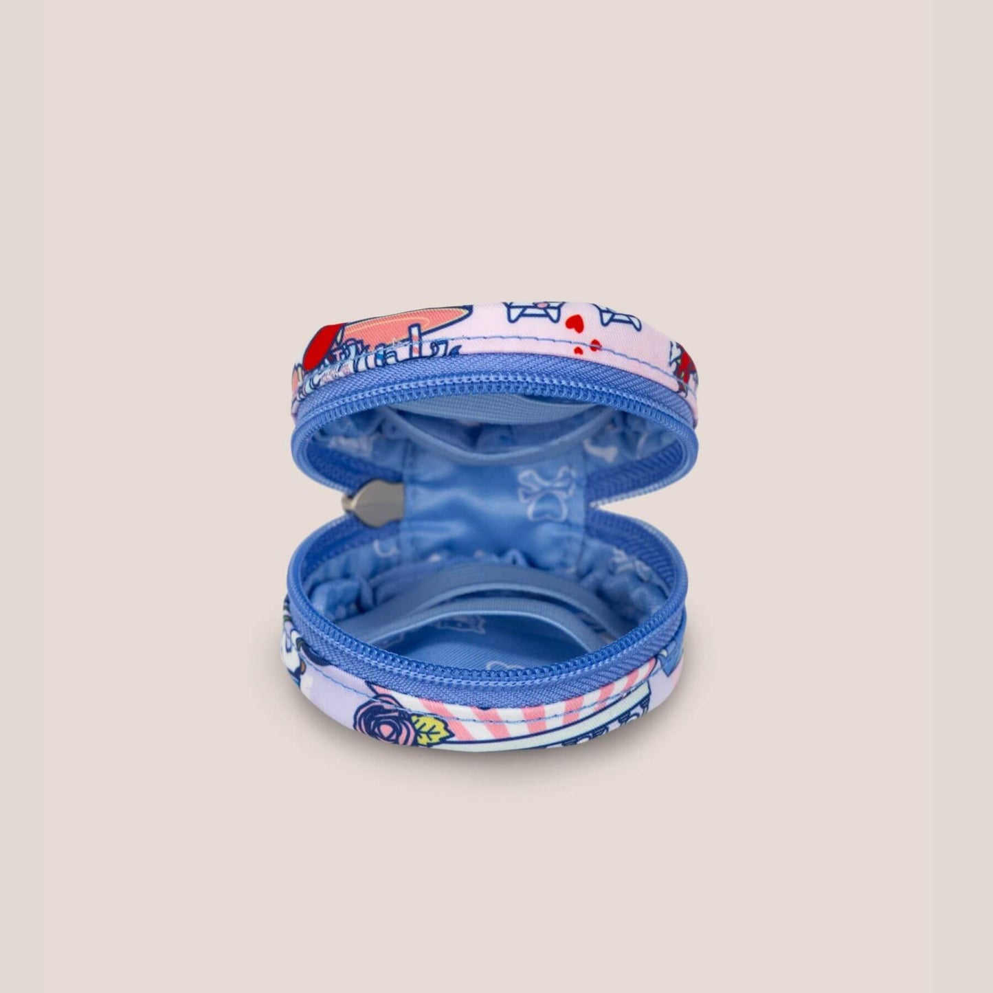 Small round pouch with a colorful top and blue interior on a beige background