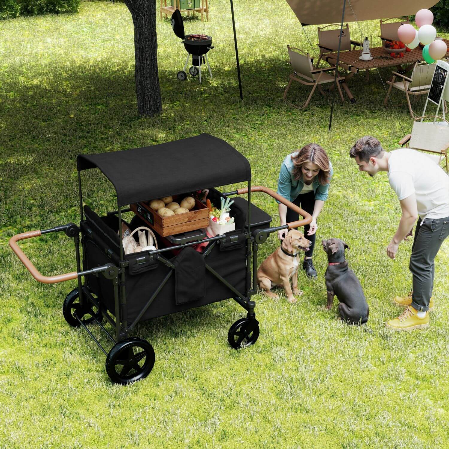ToyRides Elite Wagon Stroller with 4-Seater - Black is shown outdoors on a grassy lawn, being used by a woman and a man with two dogs