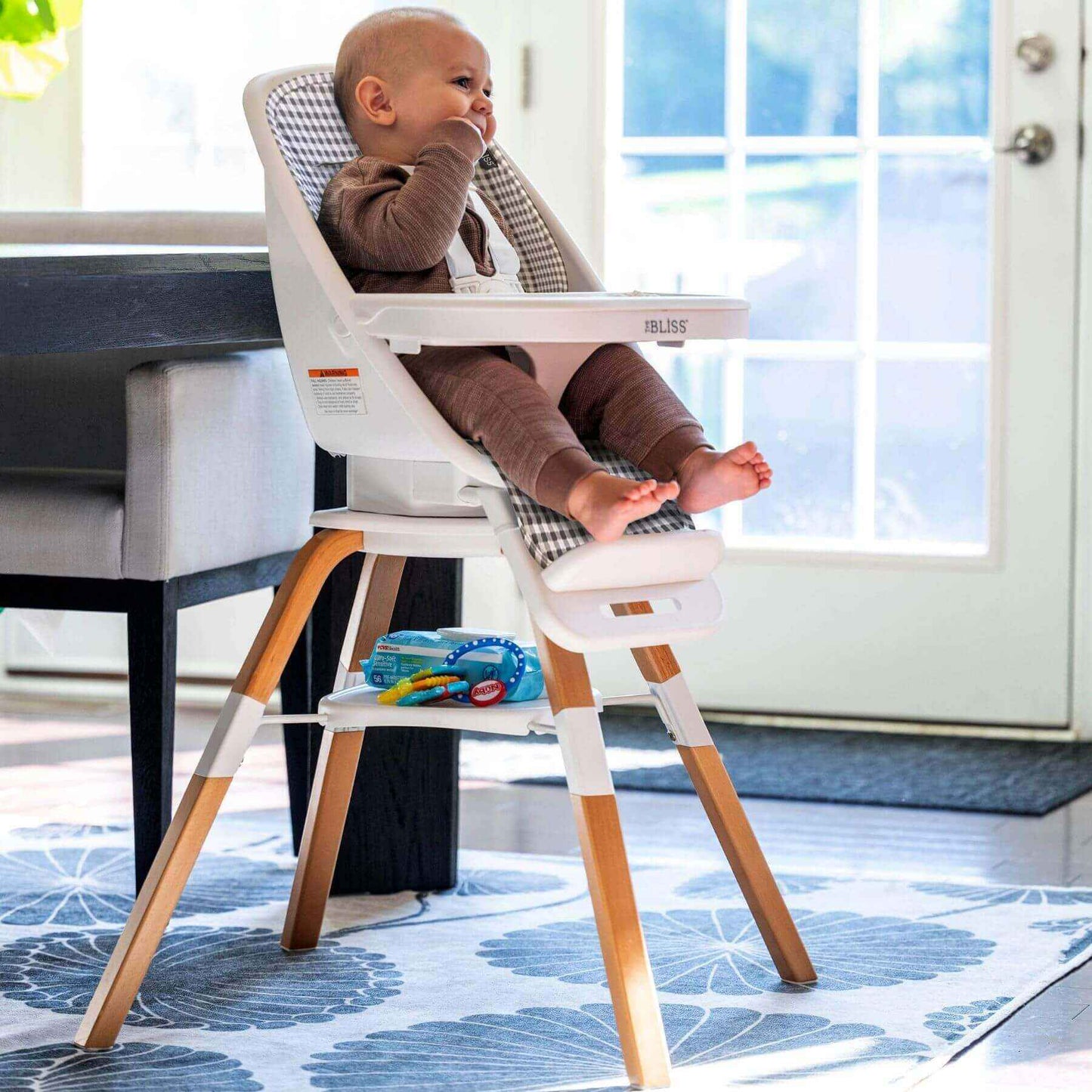 Baby Sitting on TruBliss 2-in-1 Turn-A-Tot Highchair with 360° Swivel Gingham