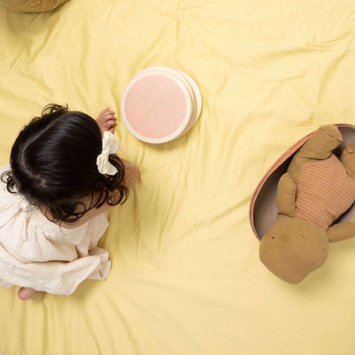 Girl playing on Toki Kids Tutu + Daisy Organic Cotton Mat