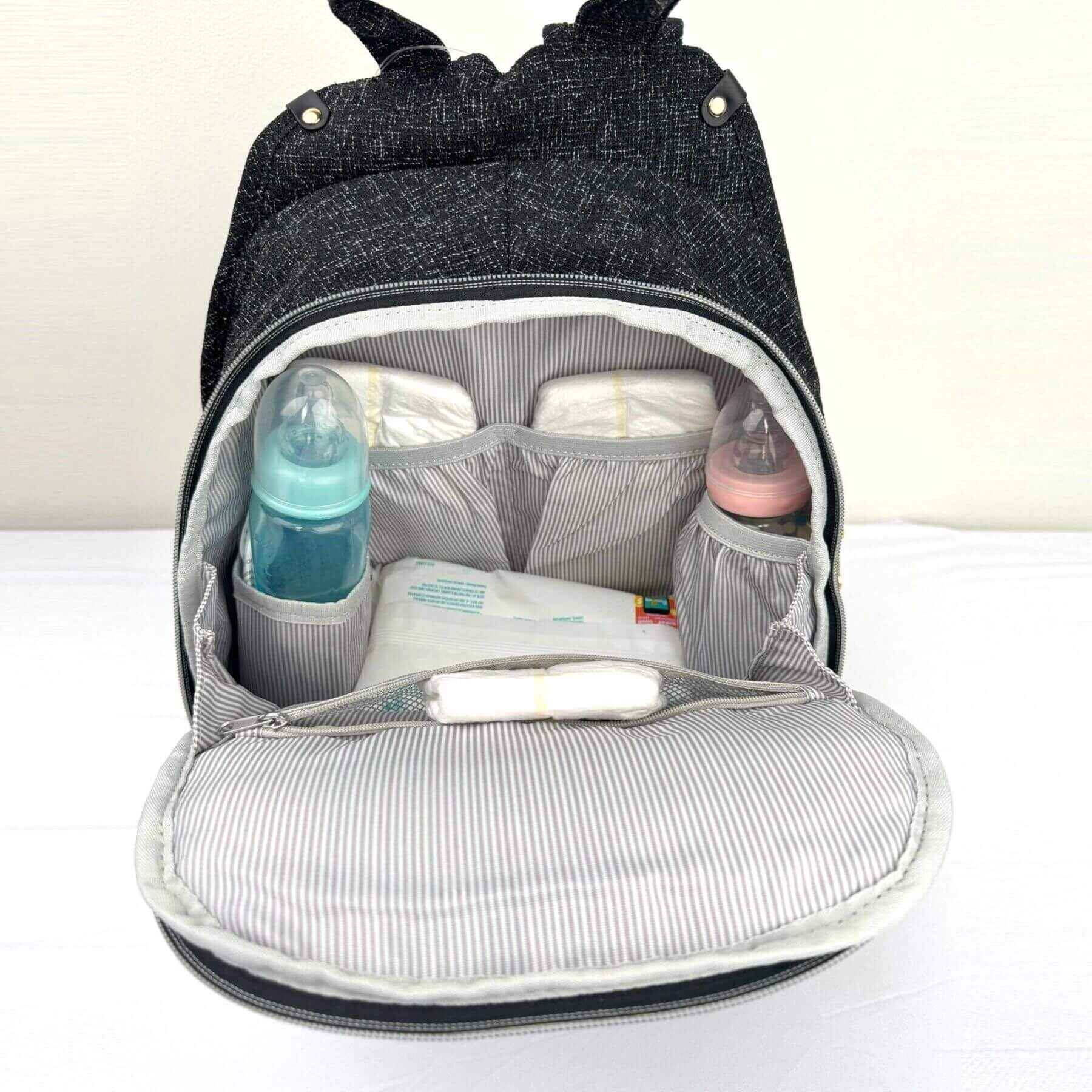 Sunveno Tweed Luxe Diaper Bag Backpack - Black with baby items organized inside