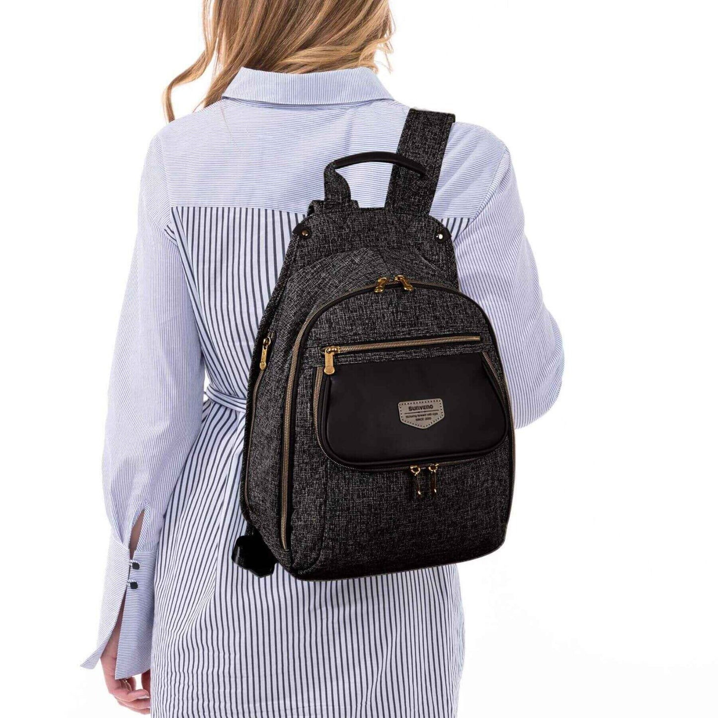 Person wearing Sunveno Tweed Luxe Diaper Bag Backpack - Black on a white background