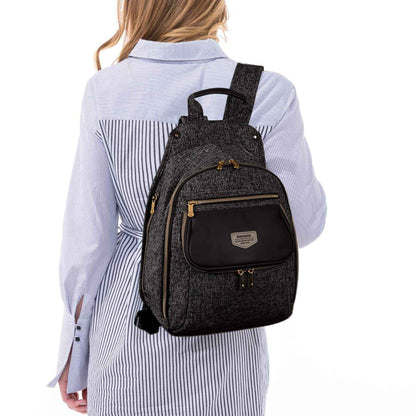 Person wearing Sunveno Tweed Luxe Diaper Bag Backpack - Black on a white background
