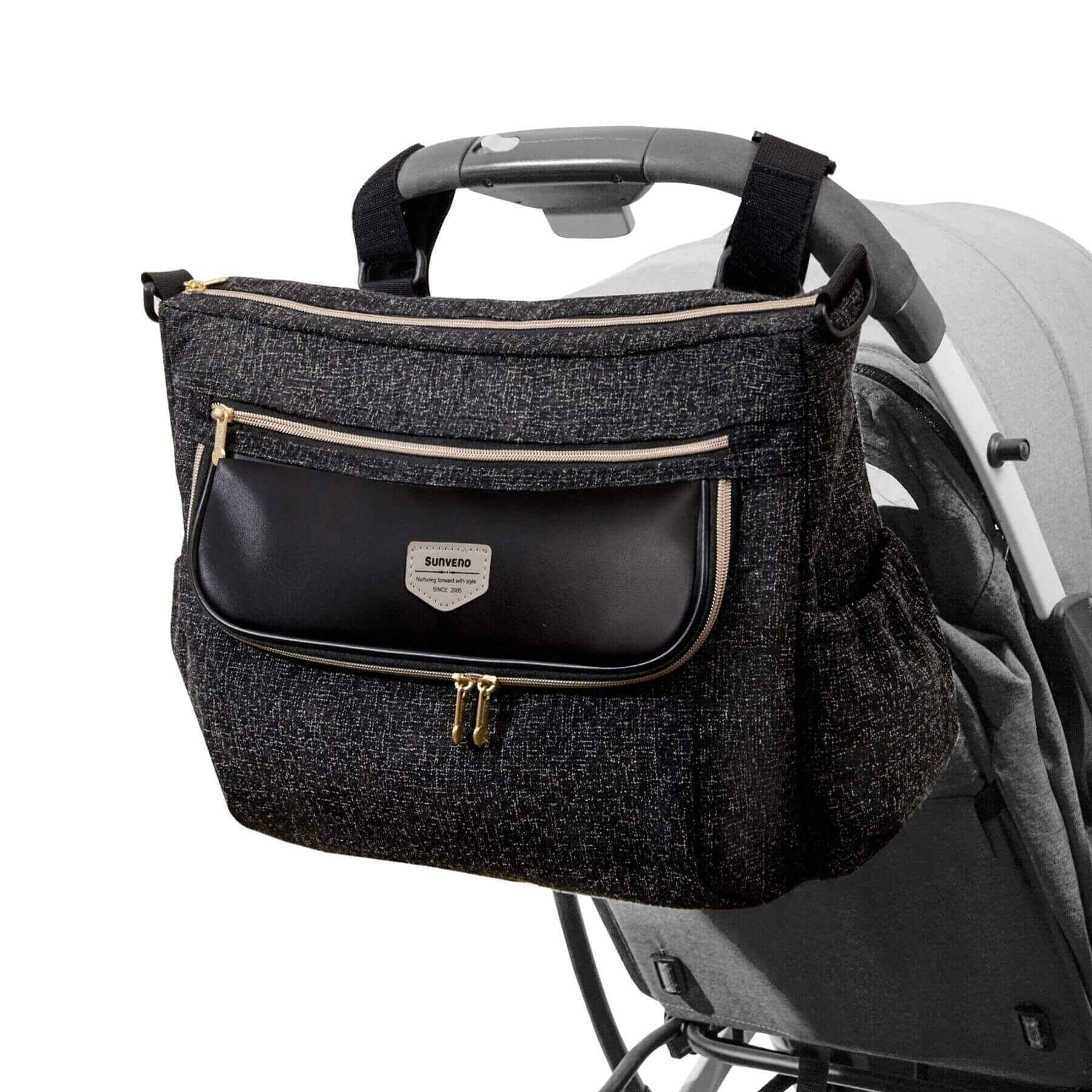 Tweed Luxe Stroller Organizer Black attached to a stroller on a white background