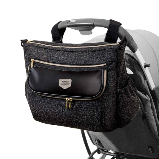 Tweed Luxe Stroller Organizer Black attached to a stroller on a white background