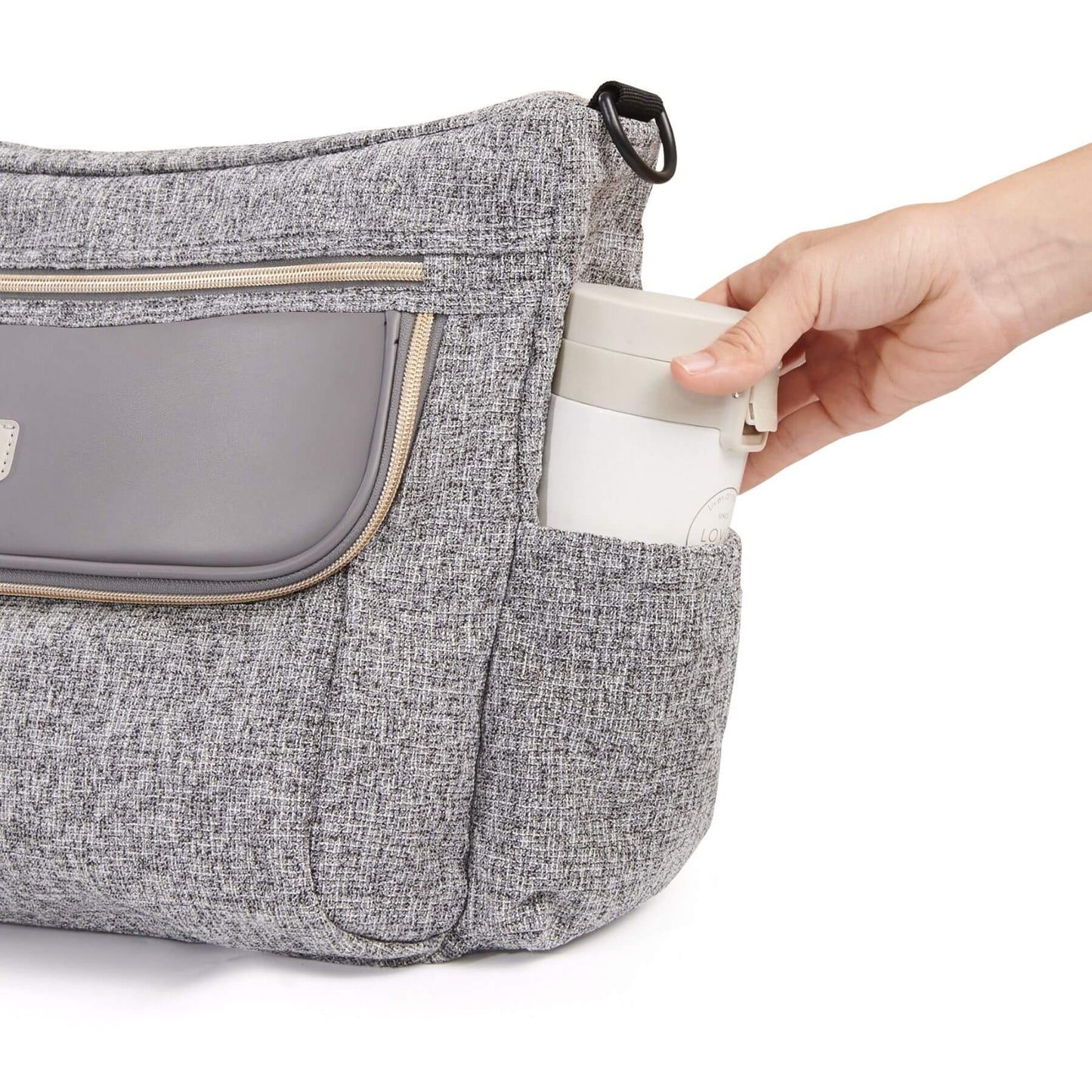 Tweed Luxe Stroller Organizer Grey with a hand placing a white container into a pocket on a white background